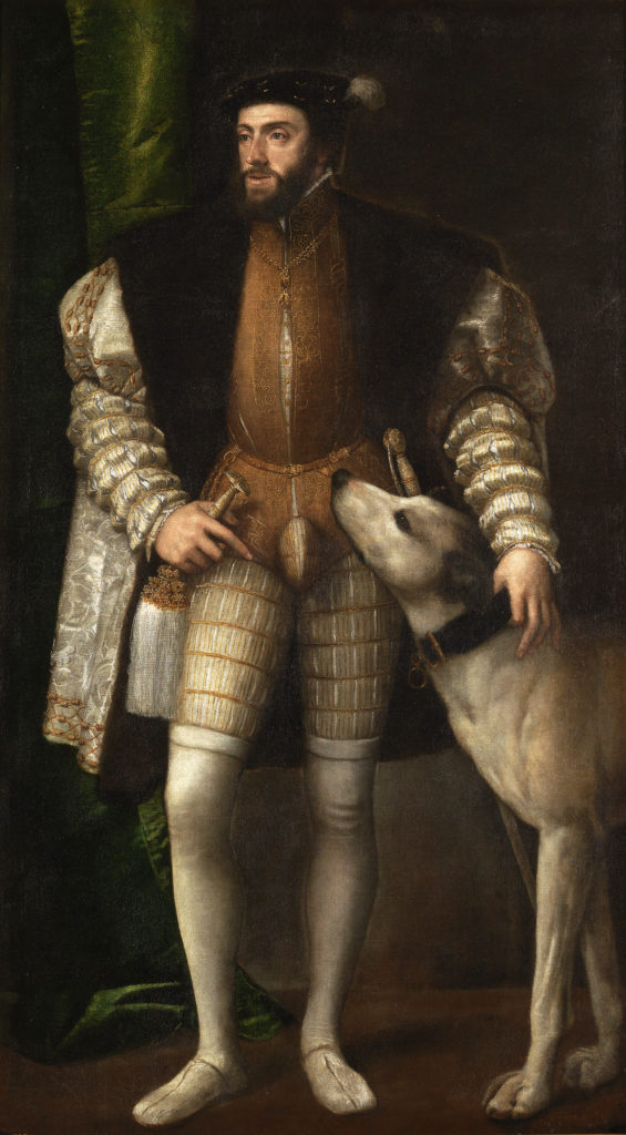 Carlos I de España luce calzas en este retrato creado por Tiziano, 1532-1533. Imagen vía wikimedia commons